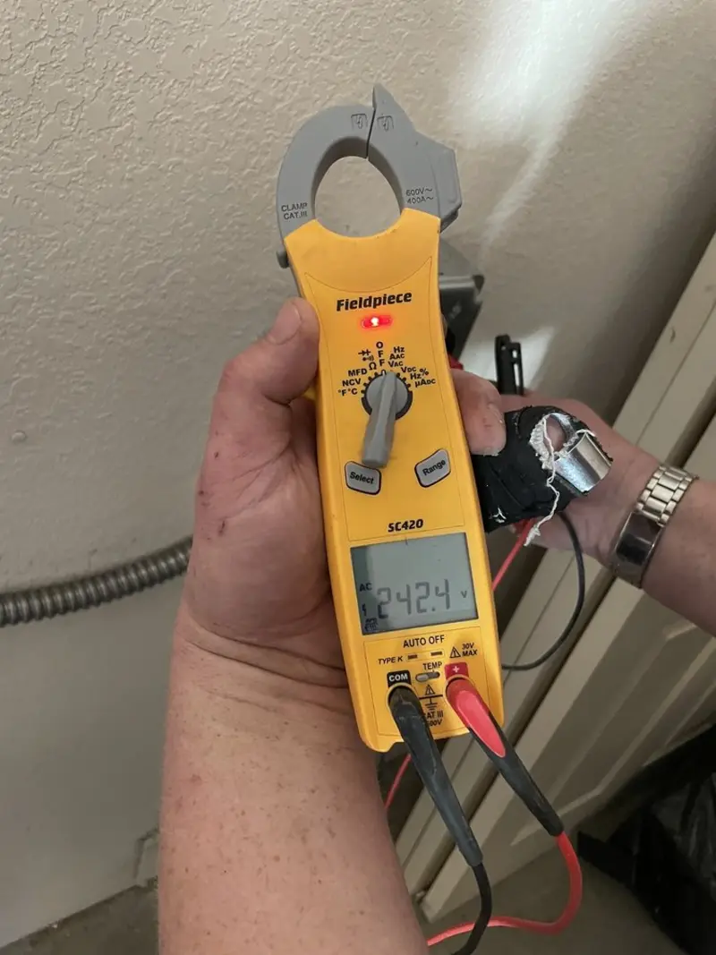 Voltage testing with clamp meter during Aluminum Wiring Replacement in Mount Healthy Heights
